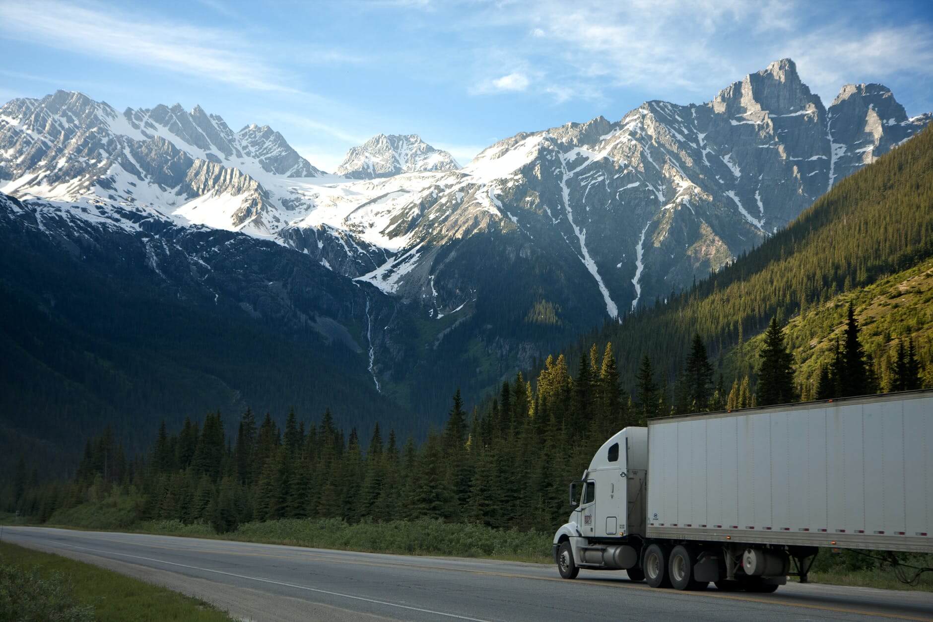 Heavy duty truck next to a mountain